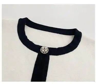 Conjunto color marfil top de manga larga y media falda